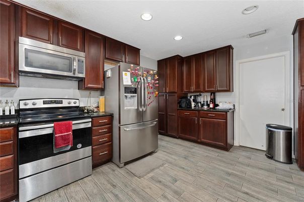 Interior, Kitchen, Recessed Lighting, Stainless Steel Appliances, Wood Texture Flooring
