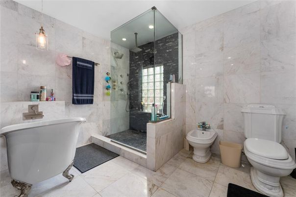 Bathroom, Free Standing Baths, Glass Shower, Interior, Marble Walls, Recessed Lighting
