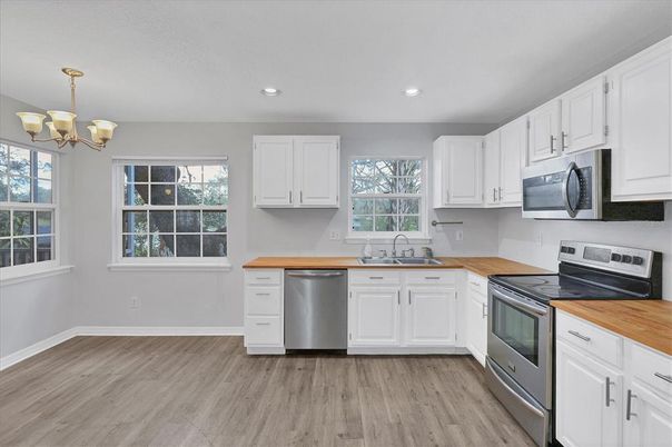 Chandelier, Interior, Kitchen, Recessed Lighting, Stainless Steel Appliances, Wood Texture Flooring