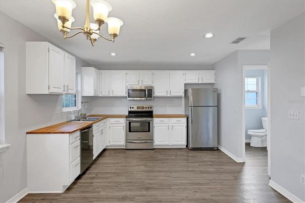 Chandelier, Interior, Kitchen, Recessed Lighting, Stainless Steel Appliances, Wood Texture Flooring