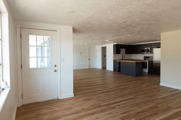 Empty room, Interior, Kitchen, Stainless Steel Appliances, Wood Texture Flooring