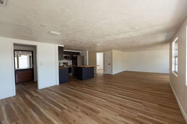 Empty room, Interior, Kitchen, Stainless Steel Appliances, Wood Texture Flooring