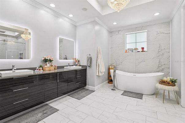 Bathroom, Chandelier, Dual Sink Vanities, Free Standing Baths, Interior, Marble, Marble Walls, Recessed Lighting