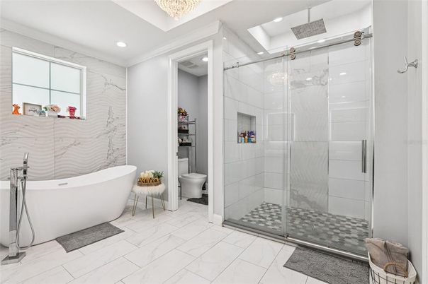 Bathroom, Free Standing Baths, Glass Shower, Interior, Marble, Marble Walls, Recessed Lighting