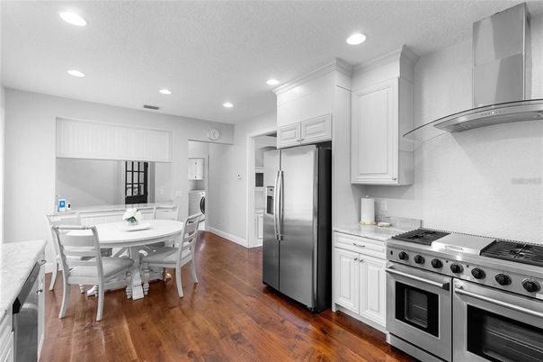 Dining room, Interior, Kitchen, Recessed Lighting, Stainless Steel Appliances, Wood Texture Flooring