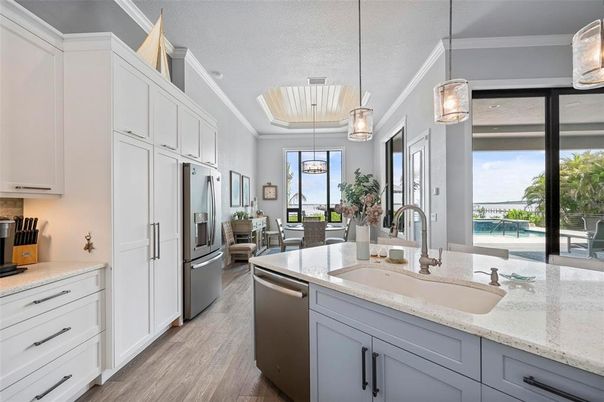 Dining room, Interior, Kitchen, Pendant Lights, Stainless Steel Appliances, Water, Wood Texture Flooring