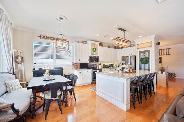 Chandelier, Dining room, Interior, Kitchen, Pendant Lights, Recessed Lighting, Stainless Steel Appliances, Wood Texture Flooring