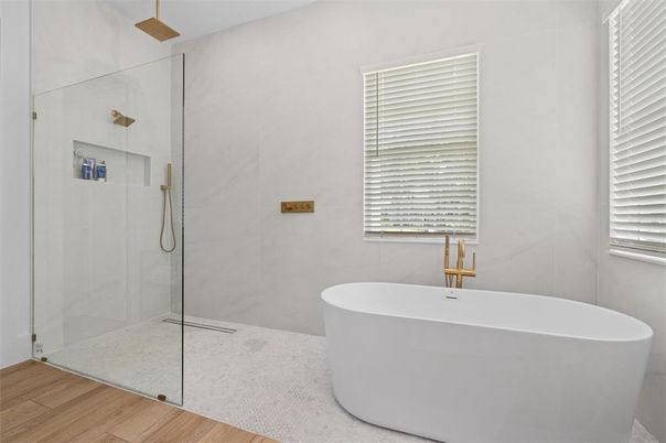 Bathroom, Free Standing Baths, Glass Shower, Interior, Marble Walls, Wood Texture Flooring