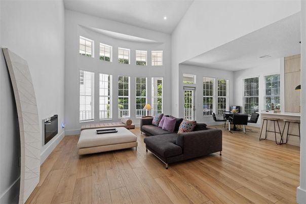 Dining room, Fireplace, Interior, Living room, Recessed Lighting, Wood Texture Flooring