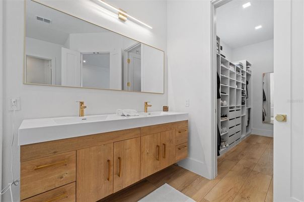 Bathroom, Dual Sink Vanities, Interior, Recessed Lighting, Walk-in Closets, Wood Texture Flooring