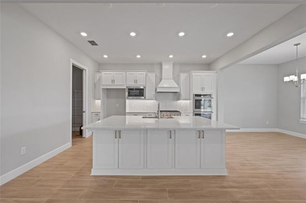 Chandelier, Interior, Kitchen, Pendant Lights, Recessed Lighting, Stainless Steel Appliances, Wood Texture Flooring