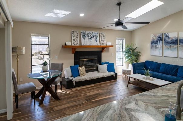 Dining room, Fireplace, Interior, Living room, Recessed Lighting, Wood Texture Flooring