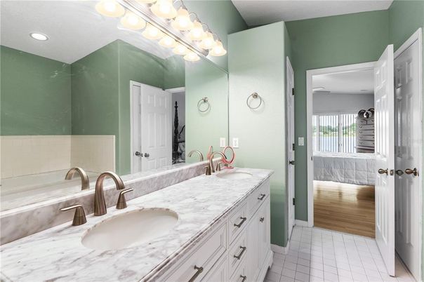 Bathroom, Dual Sink Vanities, Interior, Recessed Lighting, Wood Texture Flooring