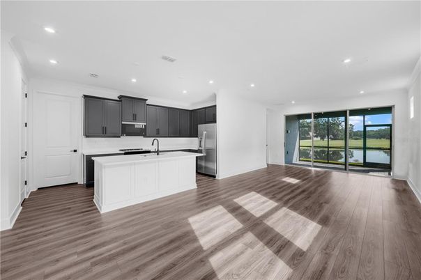 Empty room, Interior, Kitchen, Recessed Lighting, Water, Wood Texture Flooring