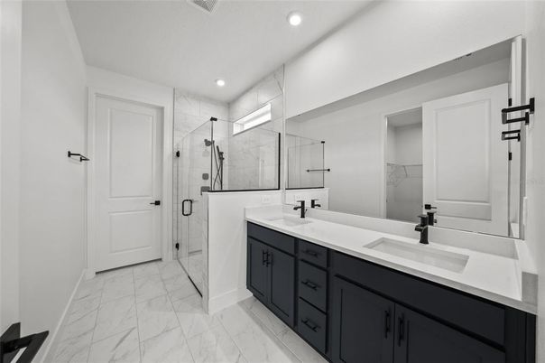 Bathroom, Dual Sink Vanities, Glass Shower, Interior, Marble, Marble Walls, Recessed Lighting