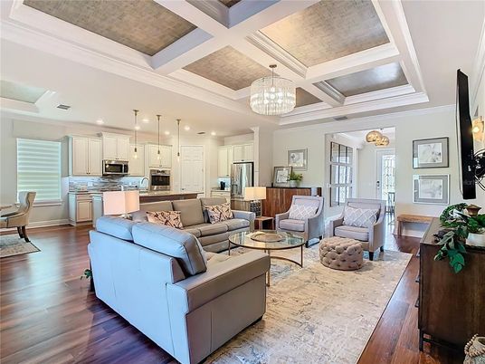Chandelier, Interior, Kitchen, Living room, Pendant Lights, Recessed Lighting, Stainless Steel Appliances, Wood Texture Flooring