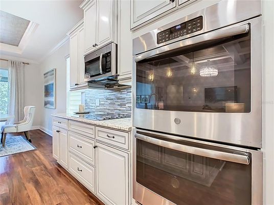 Dining room, Interior, Kitchen, Pendant Lights, Stainless Steel Appliances, Wood Texture Flooring