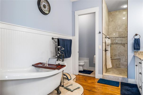 Bathroom, Free Standing Baths, Glass Shower, Interior, Recessed Lighting, Wood Texture Flooring
