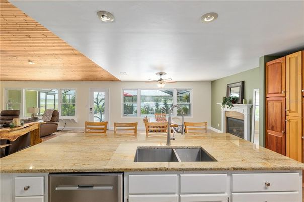 Dining room, Fireplace, Interior, Kitchen, Living room, Recessed Lighting, Wooden Ceilings