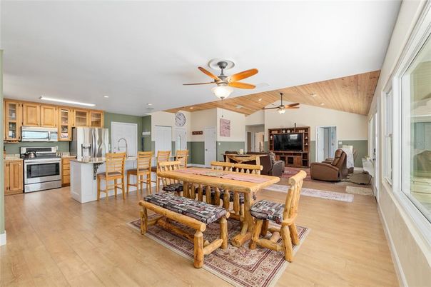 Dining room, Interior, Kitchen, Living room, Recessed Lighting, Stainless Steel Appliances, Wooden Ceilings, Wood Texture Flooring