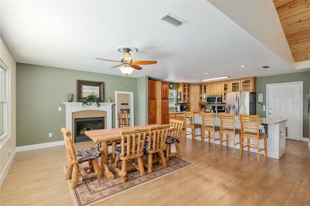 Dining room, Fireplace, Interior, Kitchen, Recessed Lighting, Wood Texture Flooring