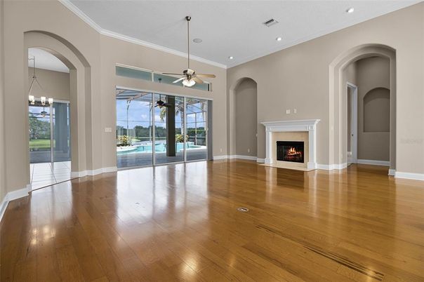 Chandelier, Empty room, Fireplace, Interior, Recessed Lighting, Wood Texture Flooring