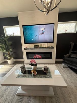 Chandelier, Fireplace, Interior, Kitchen, Stainless Steel Appliances, Wood Texture Flooring