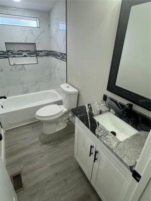 Bathroom, Dual Sink Vanities, Interior, Marble Walls, Wood Texture Flooring