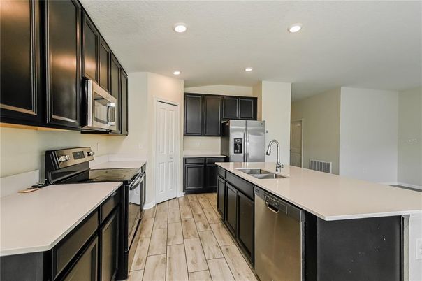 Interior, Kitchen, Recessed Lighting, Stainless Steel Appliances, Wood Texture Flooring