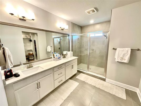 Bathroom, Dual Sink Vanities, Glass Shower, Interior, Recessed Lighting, Wood Texture Flooring