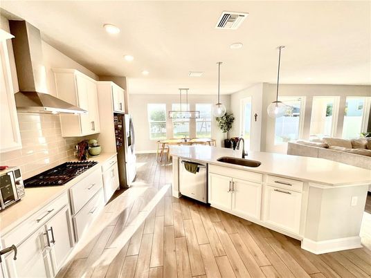 Dining room, Interior, Kitchen, Pendant Lights, Recessed Lighting, Stainless Steel Appliances, Wood Texture Flooring