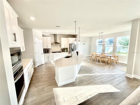 Dining room, Interior, Kitchen, Pendant Lights, Recessed Lighting, Stainless Steel Appliances, Water, Wood Texture Flooring