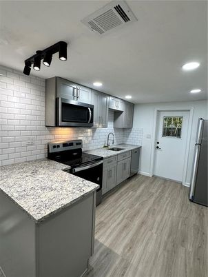 Interior, Kitchen, Recessed Lighting, Stainless Steel Appliances, Wood Texture Flooring