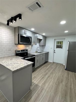 Interior, Kitchen, Recessed Lighting, Stainless Steel Appliances, Wood Texture Flooring