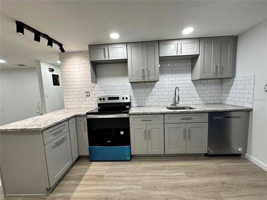 Interior, Kitchen, Recessed Lighting, Stainless Steel Appliances, Stone Walls, Wood Texture Flooring