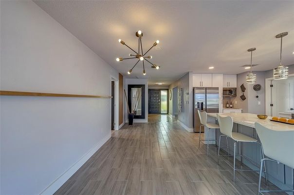 Dining room, Interior, Kitchen, Pendant Lights, Recessed Lighting, Stainless Steel Appliances, Wood Texture Flooring