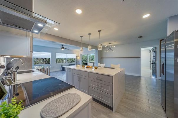 Dining room, Interior, Kitchen, Pendant Lights, Recessed Lighting, Stainless Steel Appliances, Wood Texture Flooring