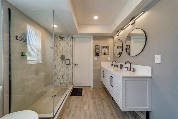 Bathroom, Dual Sink Vanities, Glass Shower, Interior, Recessed Lighting, Wood Texture Flooring