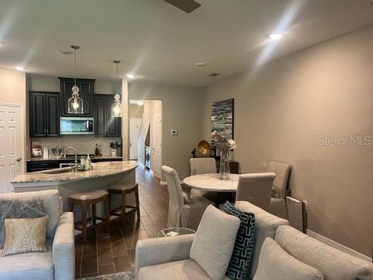 Dining room, Interior, Kitchen, Living room, Pendant Lights, Recessed Lighting, Stainless Steel Appliances, Wood Texture Flooring