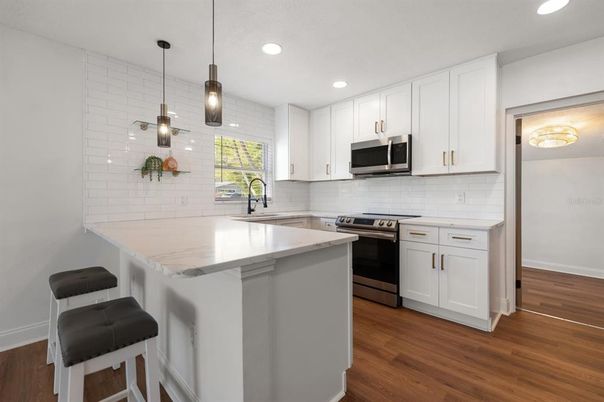 Interior, Kitchen, Pendant Lights, Recessed Lighting, Stainless Steel Appliances, Wood Texture Flooring