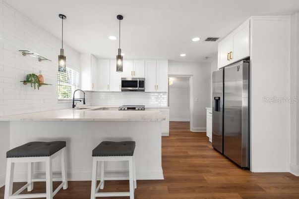 Interior, Kitchen, Pendant Lights, Recessed Lighting, Stainless Steel Appliances, Wood Texture Flooring