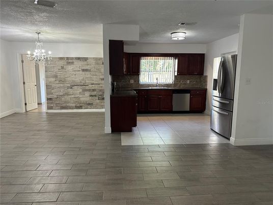 Chandelier, Interior, Kitchen, Stainless Steel Appliances, Stone Walls, Wood Texture Flooring