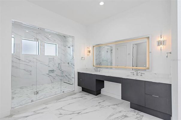 Bathroom, Dual Sink Vanities, Glass Shower, Interior, Marble, Marble Walls, Recessed Lighting