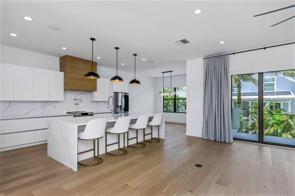 Interior, Kitchen, Marble Walls, Pendant Lights, Recessed Lighting, Wood Texture Flooring