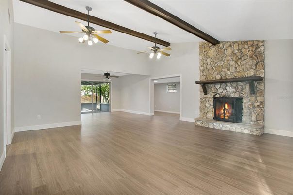Empty room, Fireplace, Interior, Stone Walls, Wooden Beams, Wood Texture Flooring