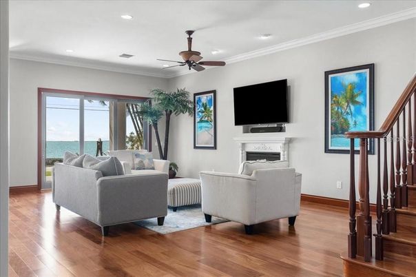 Fireplace, Interior, Living room, Recessed Lighting, Water, Wood Texture Flooring