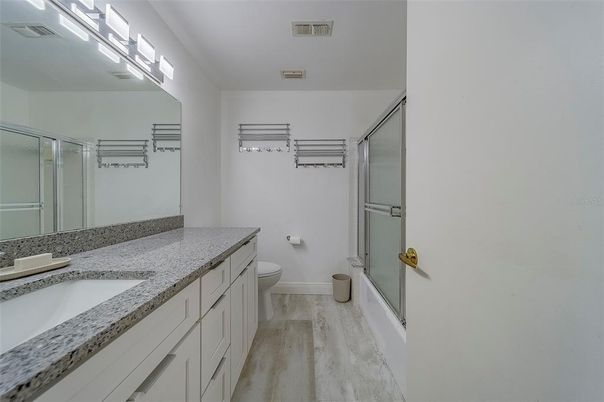 Bathroom, Dual Sink Vanities, Glass Shower, Interior, Wood Texture Flooring