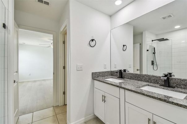 Bathroom, Dual Sink Vanities, Interior, Recessed Lighting, Wood Texture Flooring