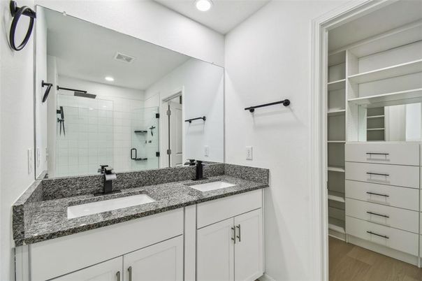 Bathroom, Dual Sink Vanities, Interior, Recessed Lighting, Walk-in Closets, Wood Texture Flooring