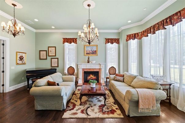 Chandelier, Fireplace, Interior, Living room, Piano, Recessed Lighting, Wood Texture Flooring